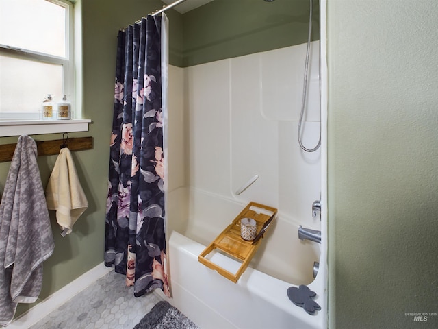 bathroom with tile patterned floors and shower / bathtub combination with curtain