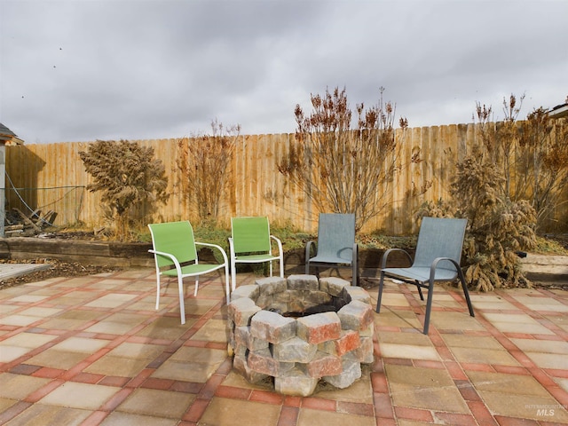 view of patio / terrace with a fire pit