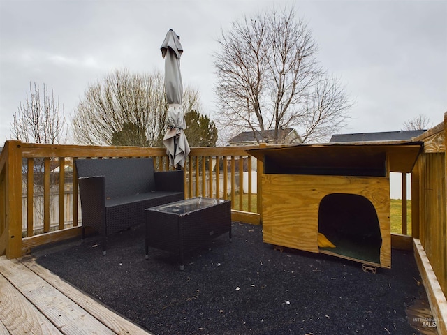 wooden deck with an outdoor hangout area