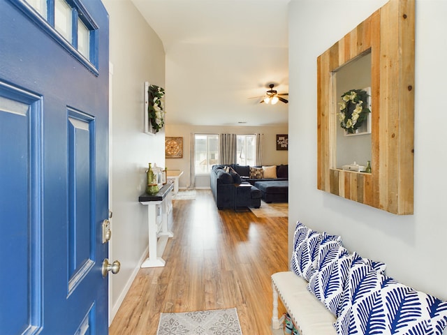 foyer entrance featuring hardwood / wood-style flooring and ceiling fan