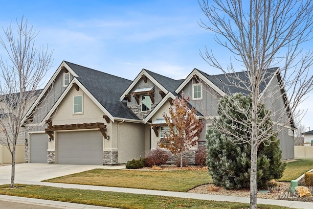 craftsman-style house with a front yard and a garage