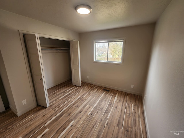 3004/3006 W Gerrard St, Boise, ID 83703 - unfurnished bedroom with hardwood / wood-style floors and a closet