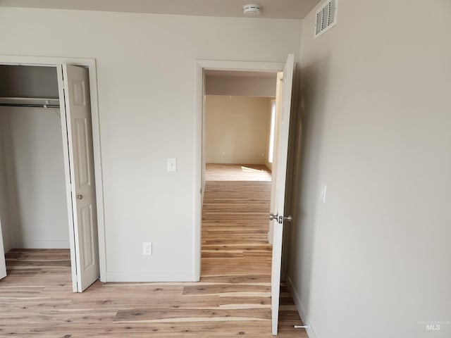 3004/3006 W Gerrard St, Boise, ID 83703 - unfurnished bedroom with light wood-style floors and a closet