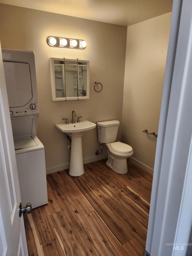3004/3006 W Gerrard St, Boise, ID 83703 - bathroom featuring stacked washer / drying machine and wood finished floors