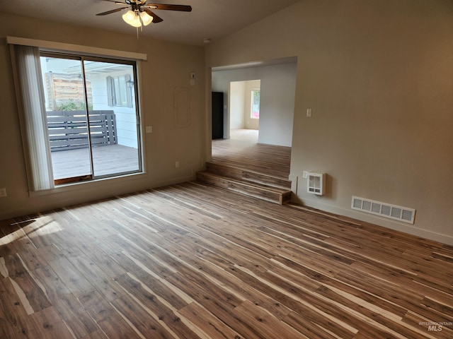 3004/3006 W Gerrard St, Boise, ID 83703 - empty room featuring hardwood / wood-style floors, a ceiling fan, vaulted ceiling, and heating unit