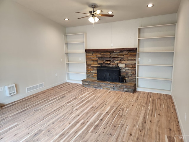 3004/3006 W Gerrard St, Boise, ID 83703 - unfurnished living room with a ceiling fan, light wood finished floors, recessed lighting, and a stone fireplace