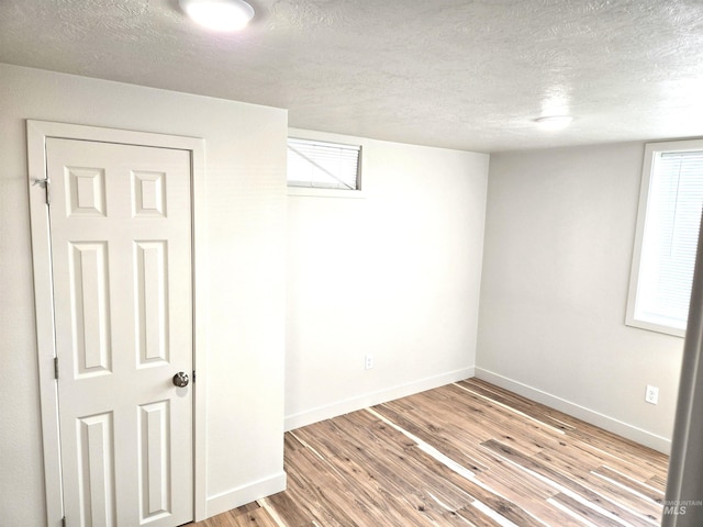 3004/3006 W Gerrard St, Boise, ID 83703 - basement featuring a textured ceiling and wood finished floors
