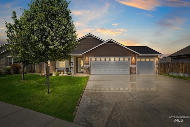 4590 E Stone Falls Dr, Nampa, ID 83686 - craftsman inspired home featuring a garage, driveway, and stone siding