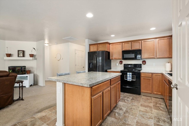 4590 E Stone Falls Dr, Nampa, ID 83686 - kitchen with black appliances, open floor plan, a kitchen island, light countertops, and recessed lighting