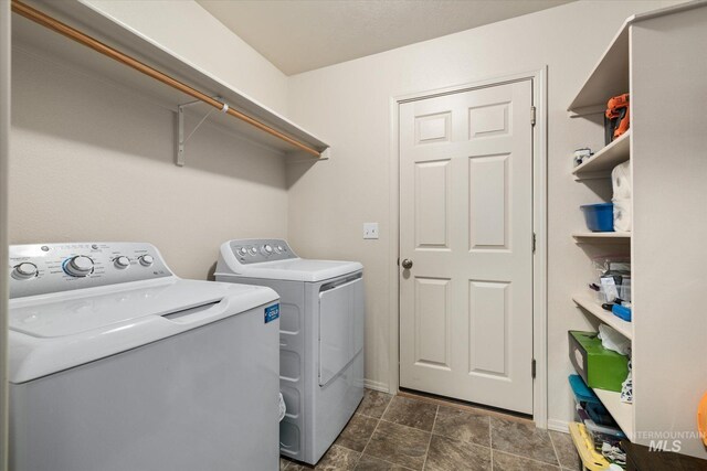 4590 E Stone Falls Dr, Nampa, ID 83686 - laundry room with independent washer and dryer, baseboards, and stone finish flooring