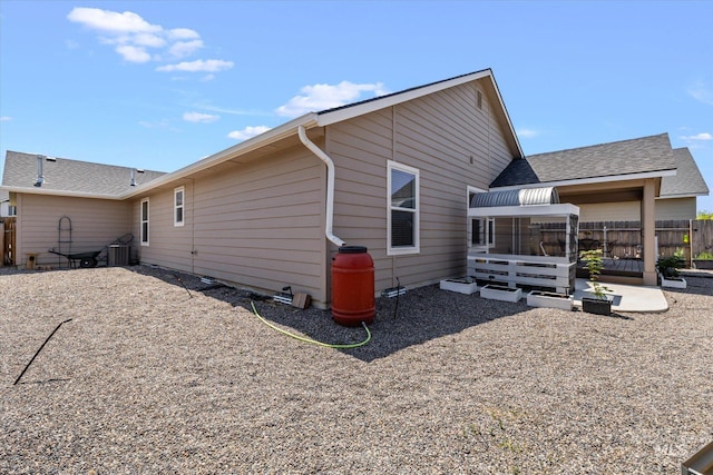 4590 E Stone Falls Dr, Nampa, ID 83686 - rear view of house featuring roof with shingles
