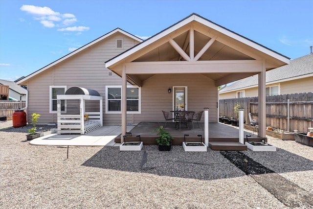 4590 E Stone Falls Dr, Nampa, ID 83686 - rear view of property featuring a wooden deck