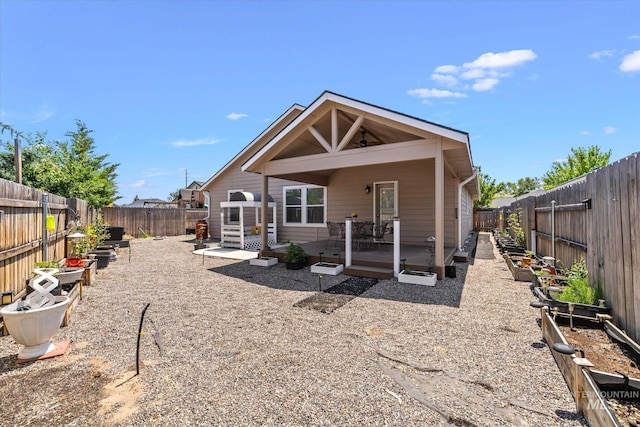4590 E Stone Falls Dr, Nampa, ID 83686 - back of house featuring a fenced backyard and a wooden deck