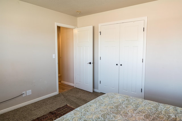 bedroom with a closet and carpet