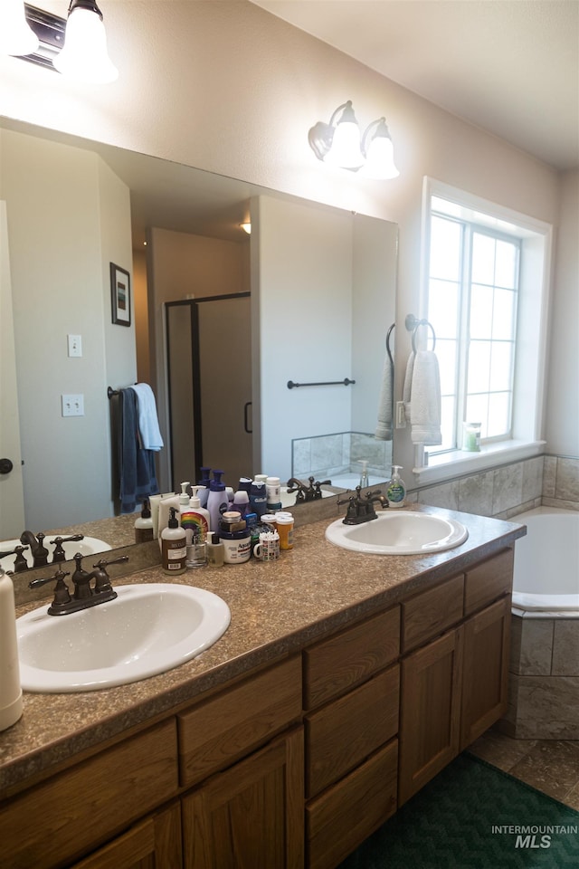 bathroom with shower with separate bathtub and vanity