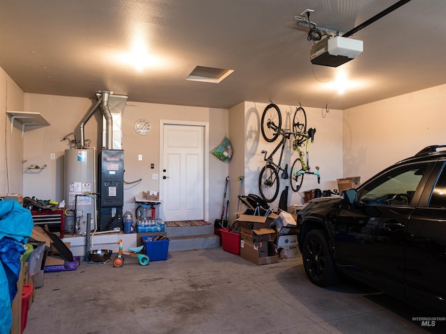 garage with gas water heater and a garage door opener