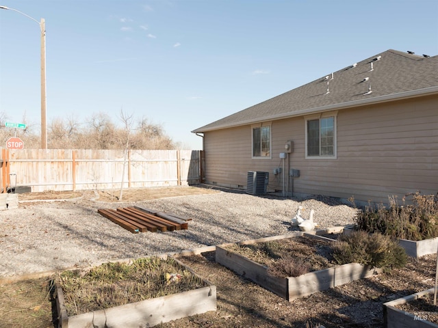 view of yard with central AC unit