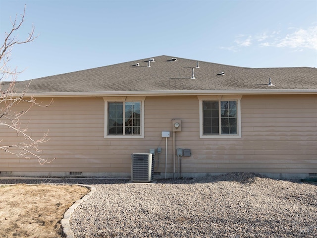 back of property with central AC