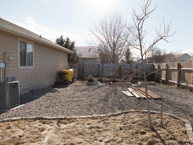 view of yard featuring central AC unit