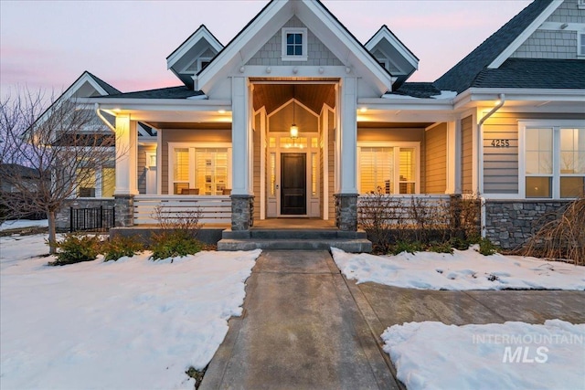 view of snow covered property entrance