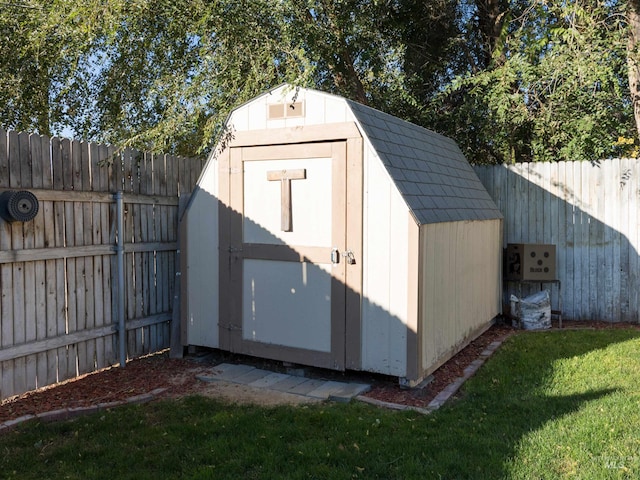 view of outdoor structure featuring a lawn