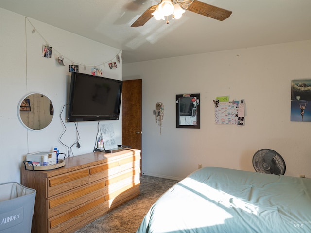 bedroom featuring dark colored carpet and ceiling fan