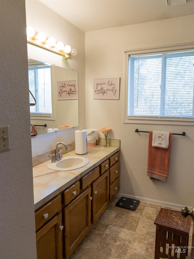 bathroom featuring vanity and a wealth of natural light