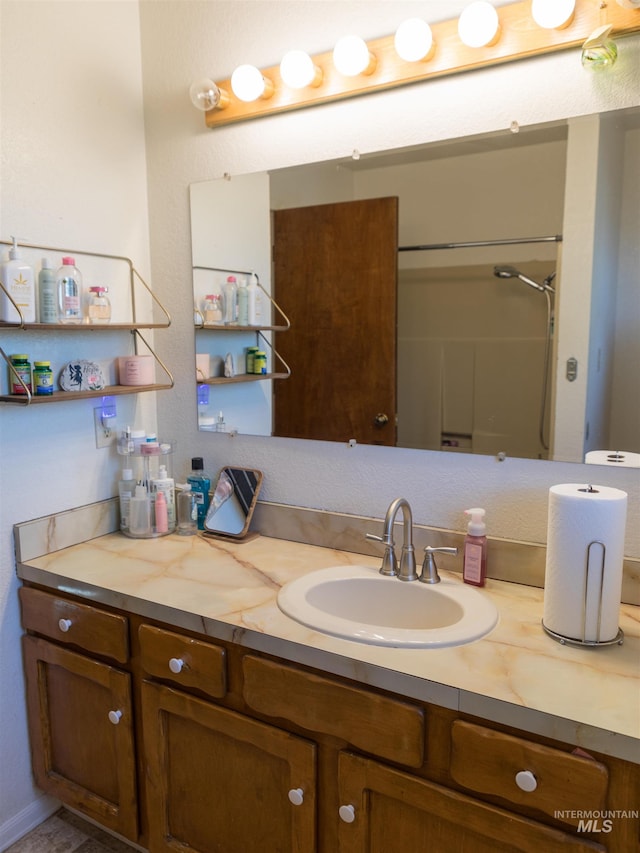 bathroom with vanity and walk in shower