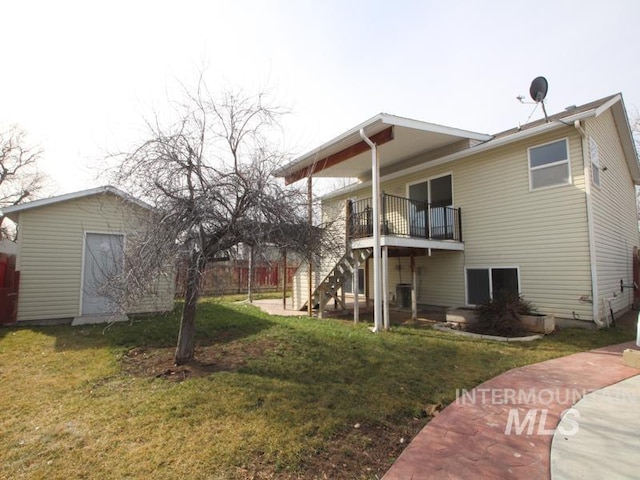 exterior space with a lawn, stairway, and fence