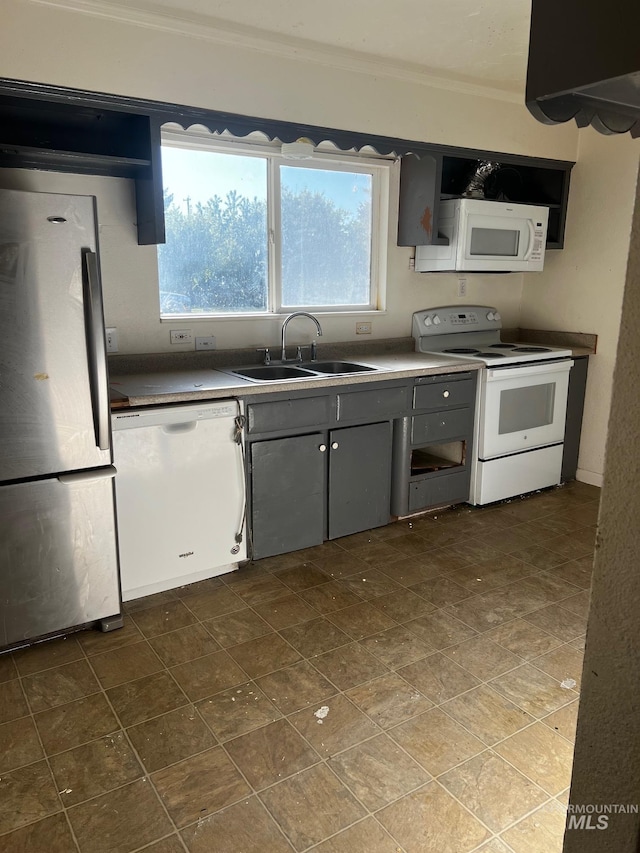 1224 Colorado, Gooding, ID 83330 - kitchen with white appliances, a sink, and ornamental molding