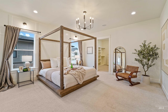 carpeted bedroom featuring a chandelier, recessed lighting, and baseboards