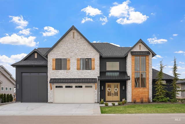 view of front of house featuring a front lawn, driveway, a standing seam roof, a shingled roof, and metal roof