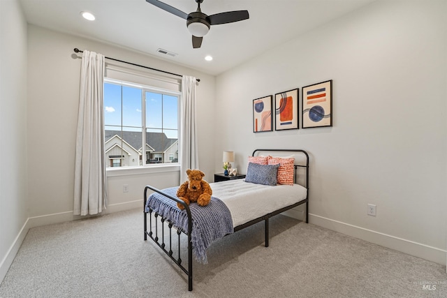 carpeted bedroom with a ceiling fan, recessed lighting, baseboards, and visible vents