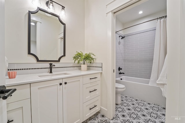 bathroom featuring vanity, toilet, shower / bath combo, and tile patterned flooring