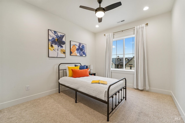 bedroom with recessed lighting, visible vents, light carpet, and baseboards