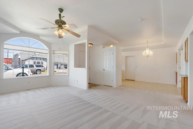 unfurnished room featuring light colored carpet and ceiling fan with notable chandelier