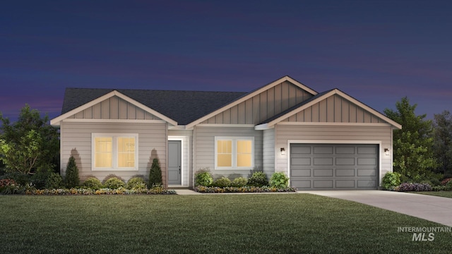 view of front facade with a garage and a lawn