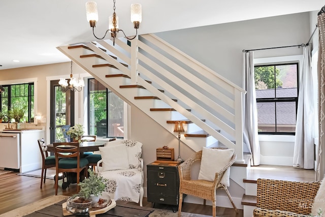 interior space with an inviting chandelier and dark wood-type flooring