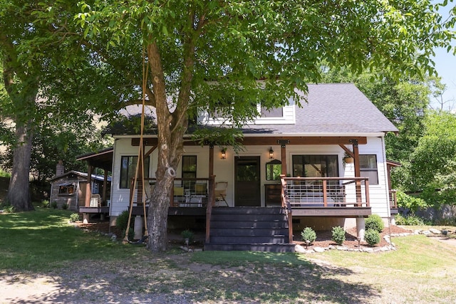 view of front of property with a porch and a front yard