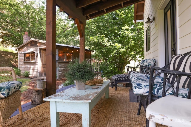 view of patio with an outdoor structure