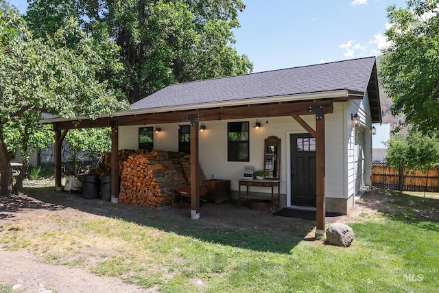 view of outbuilding with a yard