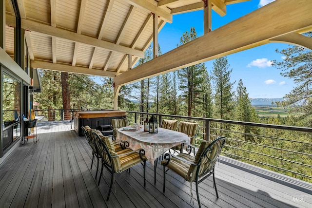 wooden deck featuring a hot tub