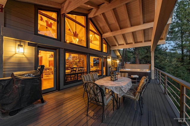 deck featuring a hot tub