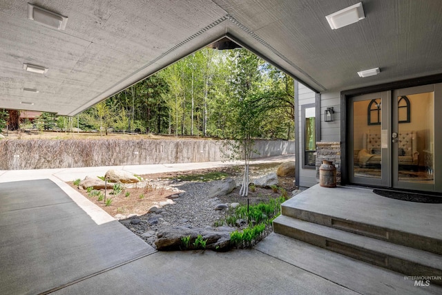 view of yard featuring french doors