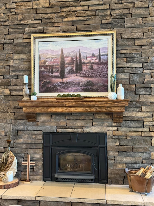 interior details with a stone fireplace