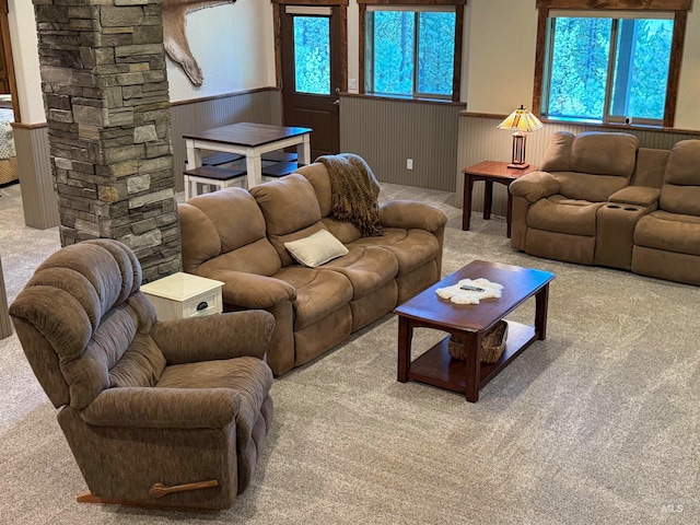 living room featuring plenty of natural light and carpet