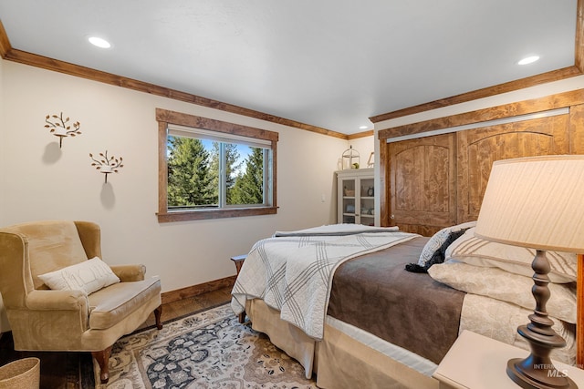 bedroom featuring wood-type flooring and crown molding