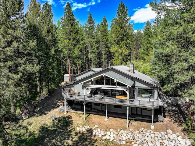 rear view of house with a deck