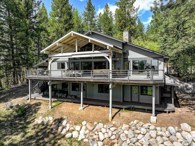 back of house featuring a deck