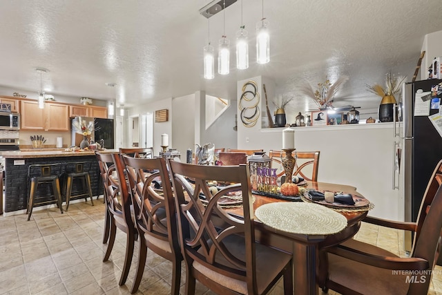 dining area with a textured ceiling